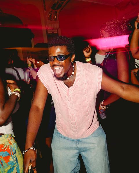 A guest dancing with his arms out, 16 May 2026